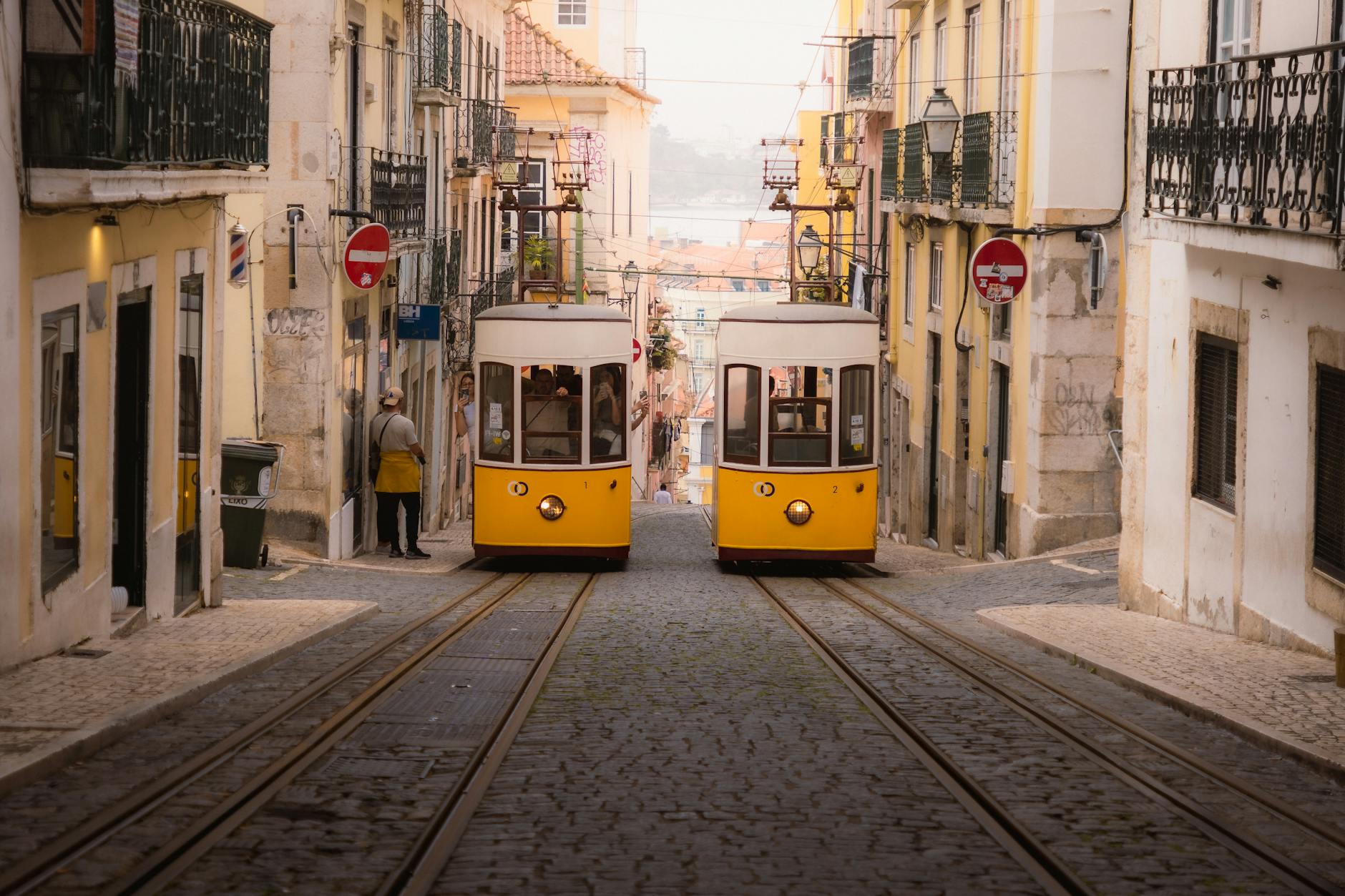 Charming yellow trams navigate the historic cobblestone streets of Lisbon's old town.